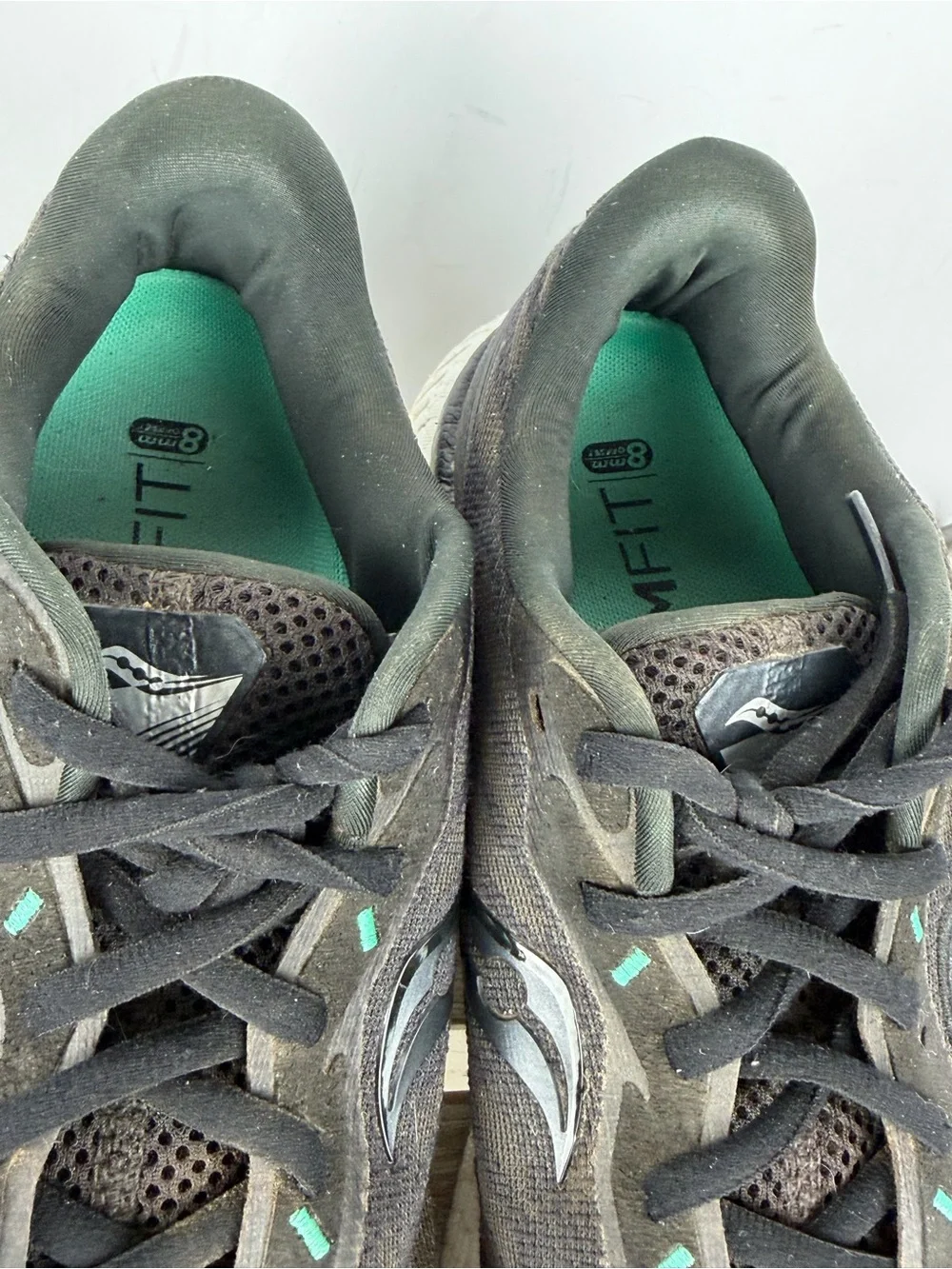 Saucony Triumph 19 running shoes in black an white with subtle teal accents 10.5